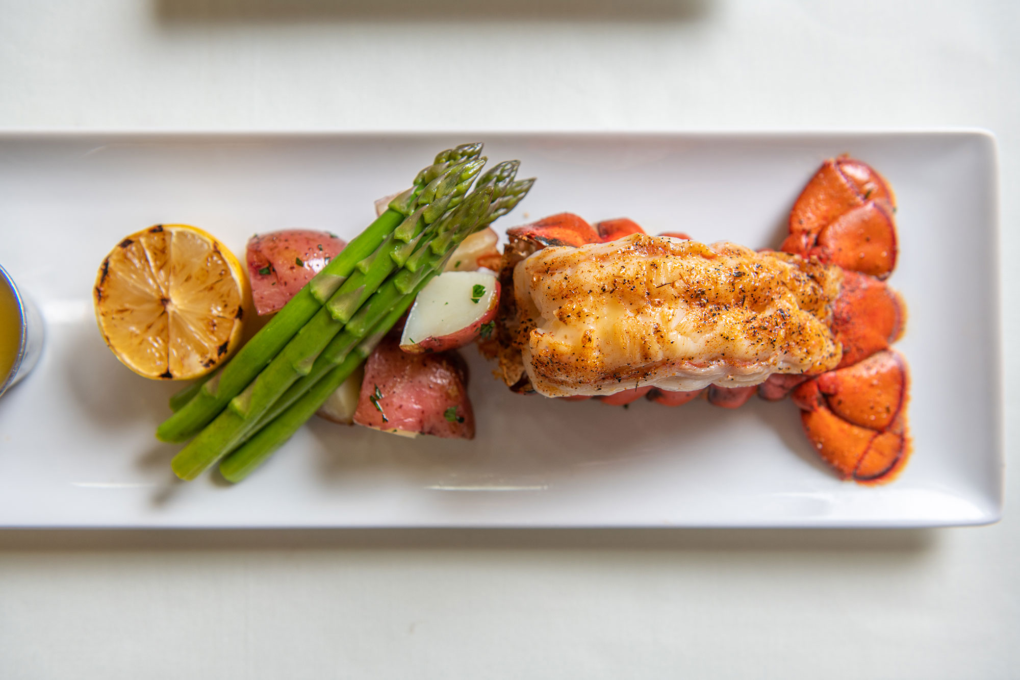 Delicious lobster tail, asparagus and potatoes at The Terraces at Bonita Springs